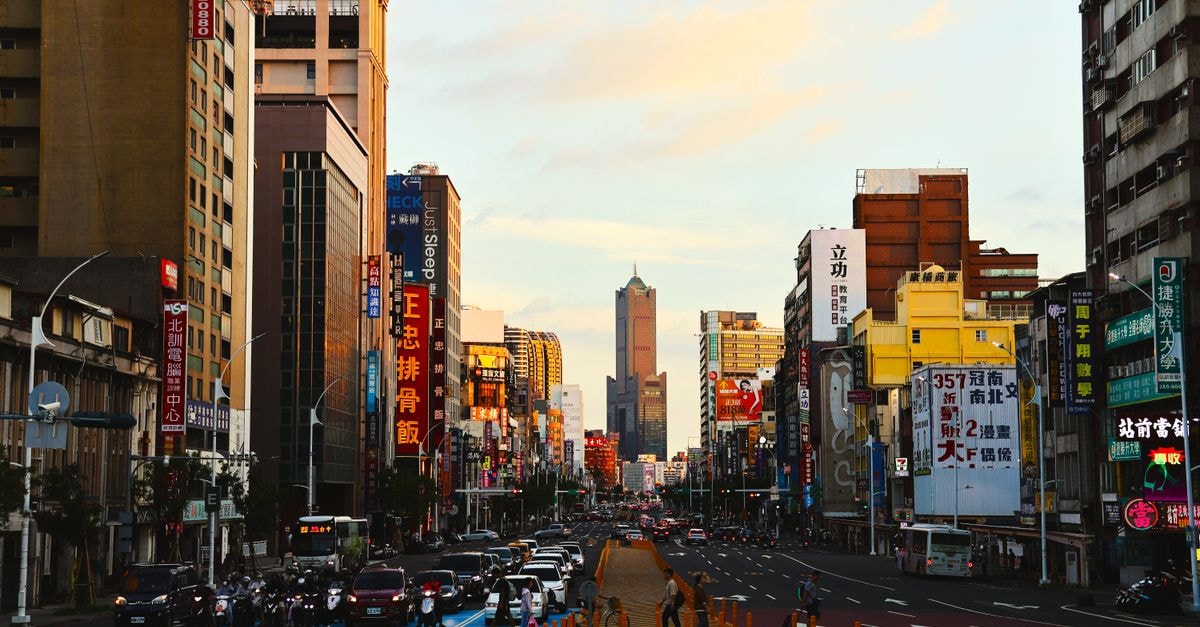 Kaohsiung Travel Guide: Planning Tips, Costs and Things to Do Explore the bustling streets of Kaohsiung, Taiwan, captured in stunning evening light.