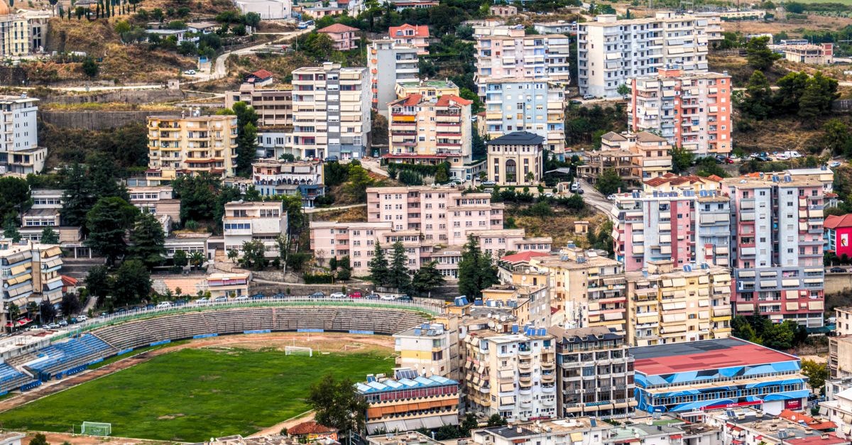 Casa Italia in Louga: A Residential Retreat with a Pool Aerial view of Gjirokastër, Albania, showcasing the densely packed cityscape and stadium.
