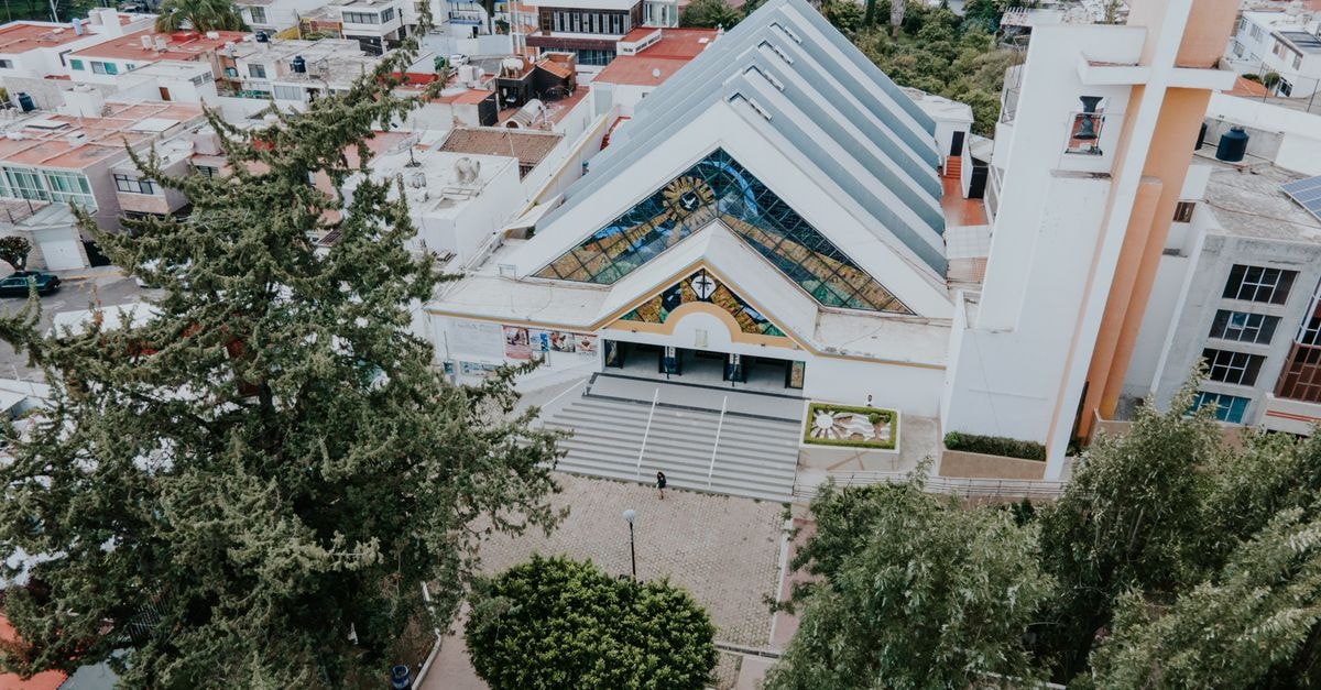 Ciudad Juárez Travel Guide: Planning Tips, Costs and Things to Do Stunning aerial view of Parroquia de San Pio X Church surrounded by urban buildings in León, Mexico.