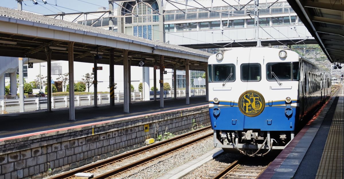 Mitsui Garden Hotel Okayama — Right by Okayama Station's South Underpass A luxury train arrives at Kure Station in Hiroshima, Japan, captured on a sunny day.
