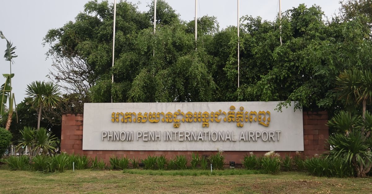 Darwin travel guide: tropical gateways, easy arrivals Signage at Phnom Penh International Airport surrounded by greenery in Cambodia.