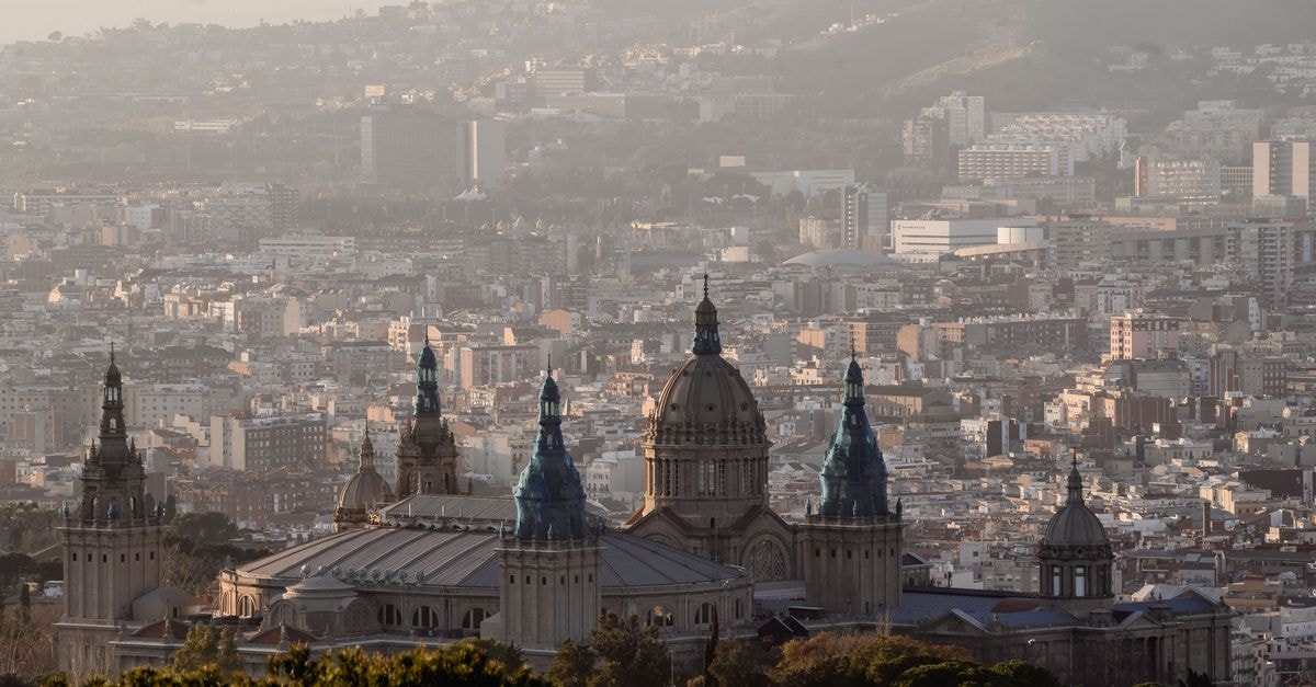 Scenic view of Barcelona with the National Art Museum foreground and cityscape background.