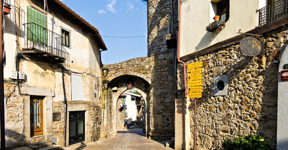 Campobasso Travel Guide: Planning Tips, Costs and Things to Do Picturesque street with stone archway in Miranda del Castañar, Spain, capturing the historic architecture.