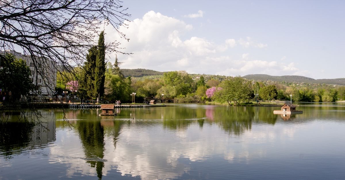 Banja Luka Travel Guide: River Calm in Republika Srpska Serene lake surrounded by trees in Stara Zagora, Bulgaria, during springtime.