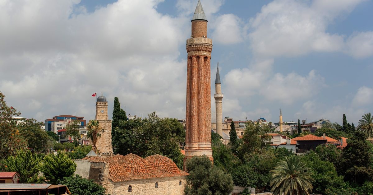 Uygulama Oteli in Tarsus: A Practical Stay Right by Atatürk Köprüsü View of Yivli Minaret overlooking Antalya's old town, with surrounding architecture.