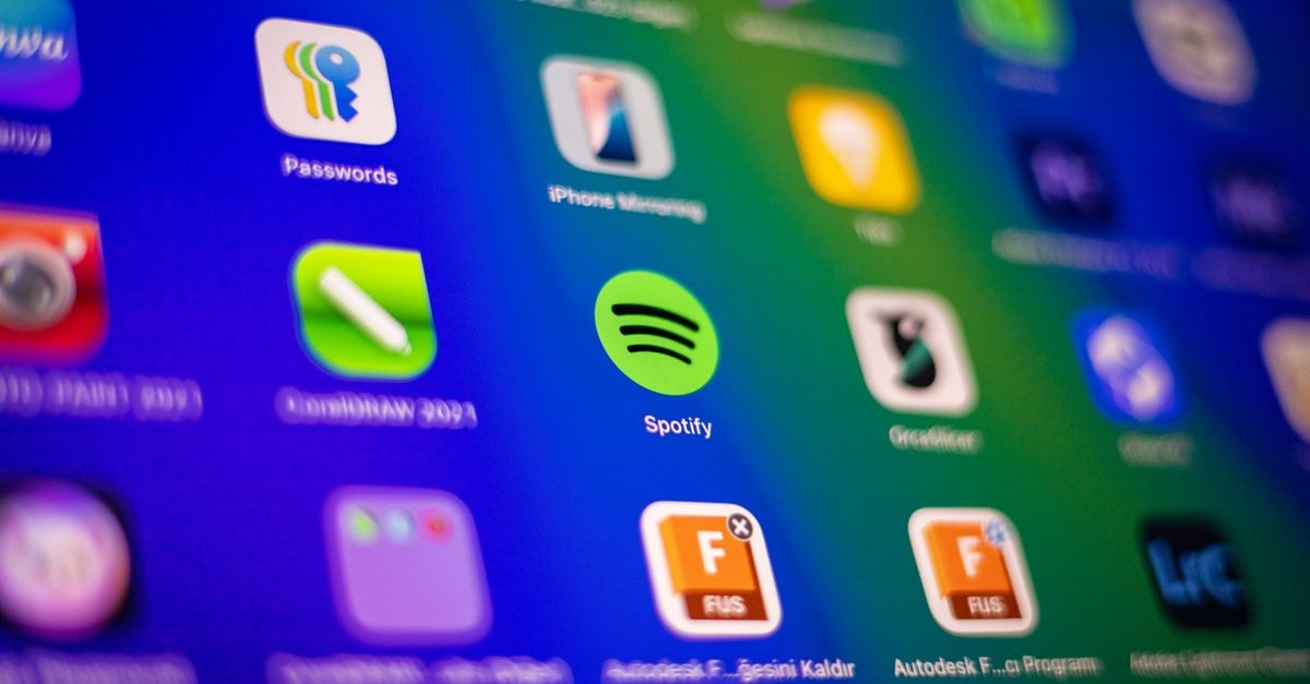KATSEYE's 'Animal' breaks Spotify global top 10 as Cortis extends long chart run Blurred close-up of vibrant app icons on a smartphone screen showcasing Spotify and more.
