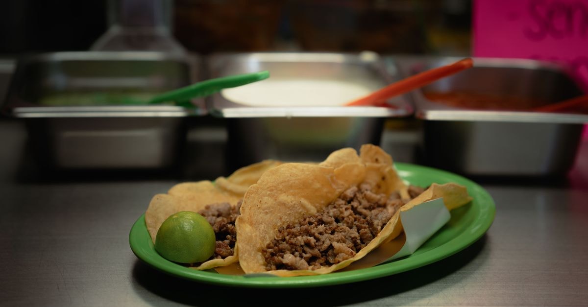 Santa Ana travel guide: art, zoos and taco trails Delicious street tacos with a lime on a vibrant plate in Mexico City.
