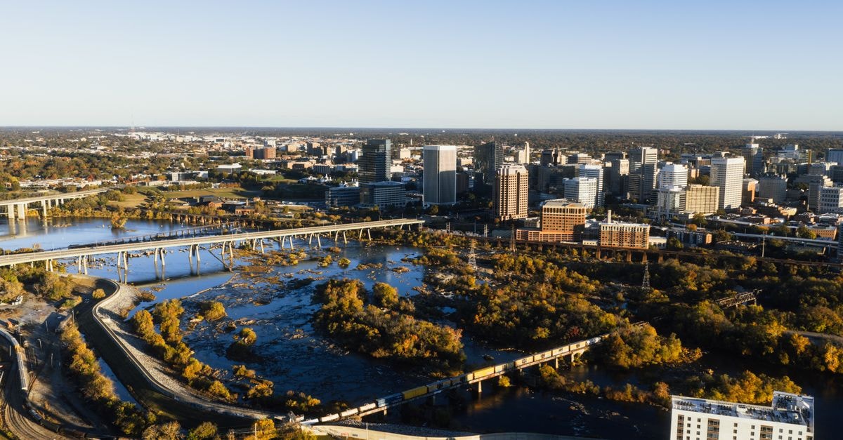 A breathtaking aerial shot of Richmond's skyline and river on a sunny day.