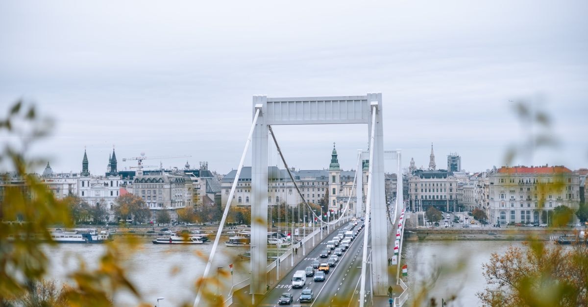 Hotel Jelena in Brčko: Ground-Floor Restaurant and Wellness Retreat Stunning aerial view of Budapest's Erzsébet Bridge with urban skyline and river.
