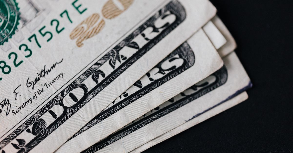 Federal Reserve approves Bank of Nova Scotia bid to acquire MapleMark Bank Closeup of USA 20 dollar banknotes placed on black background as national currency for business and personal financial operations