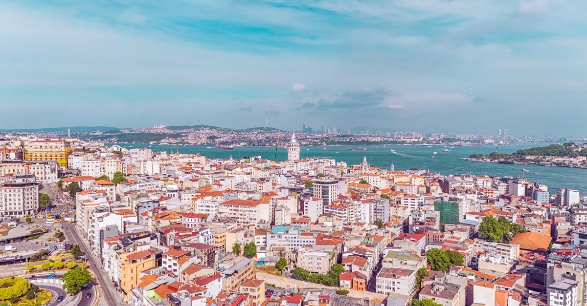 Aerial view of Istanbul's vibrant cityscape with the iconic Bosphorus, showcasing urban architecture.