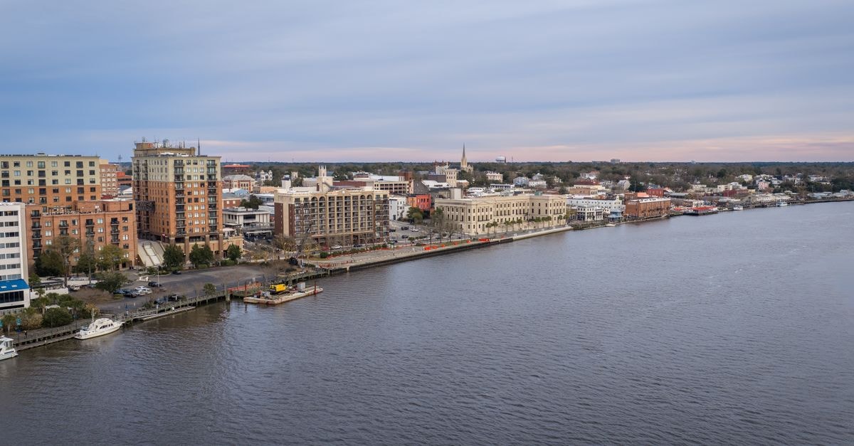 Hotel St Helena, Jamestown — Heritage Rooms Meet 1774 Walls Aerial photo of Wilmington's vibrant riverfront with buildings and waterfront view.