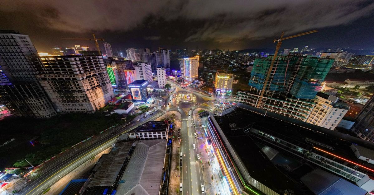 Capri at Fraser Hotel Residences, Johor Bahru — Bukit Chagar Downtown A vibrant aerial view of Sihanoukville, Cambodia illuminated at night, showcasing the city's lively atmosphere.