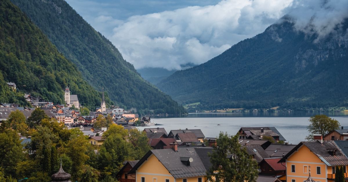 Gasthof Hirlatz in Hallstatt: A Family Guesthouse on the Trail to Dachstein A scenic view of Hallstatt, Austria, with lush mountains and serene lake.