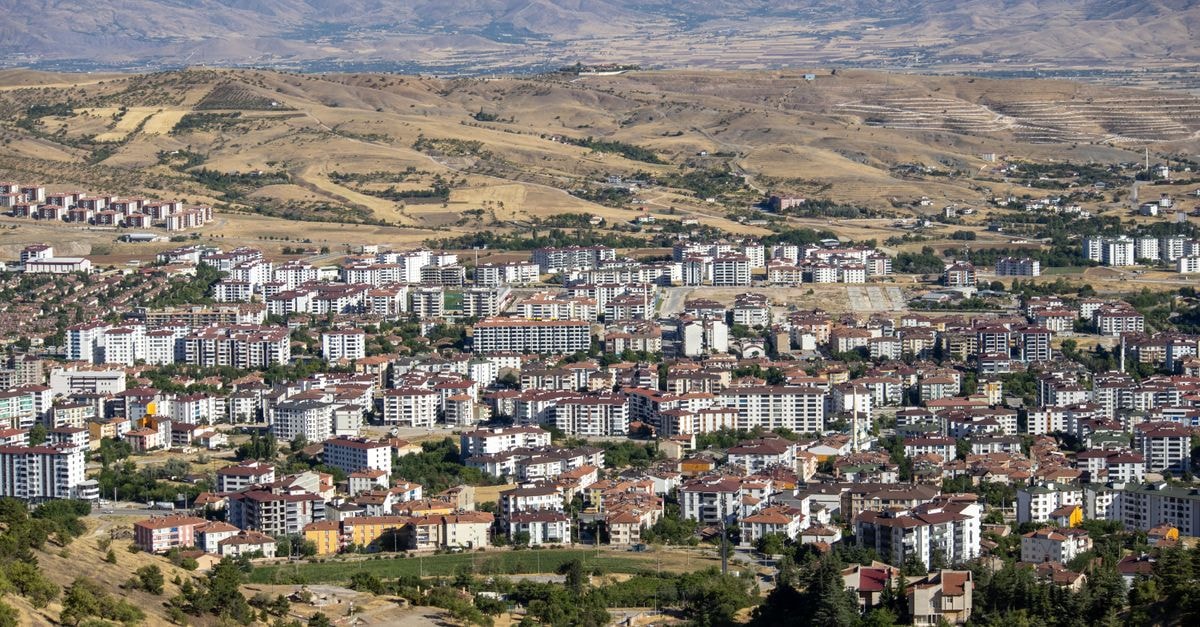 Pırlanta Hotel in Malatya: A Practical Stay on the Elazığ Road A stunning aerial view of Elâzığ city with surrounding hills in Türkiye.
