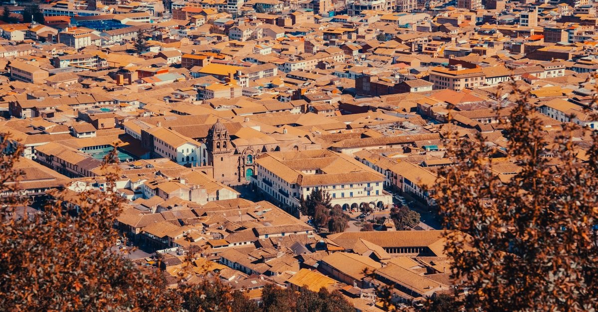 Stunning aerial view of Cusco's historic cityscape with prominent colonial architecture.
