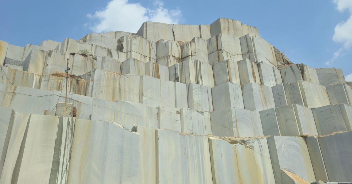 Gold rally extends across regional markets as North American investors remain on the sidelines Impressive stone quarry with geometric patterns under a clear blue sky.