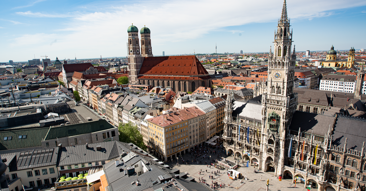 Munich Travel Guide: Getting Around, Eating Well, and Pacing Your Days Majestic aerial view of Munich's Marienplatz and Frauenkirche showcasing historic architecture.