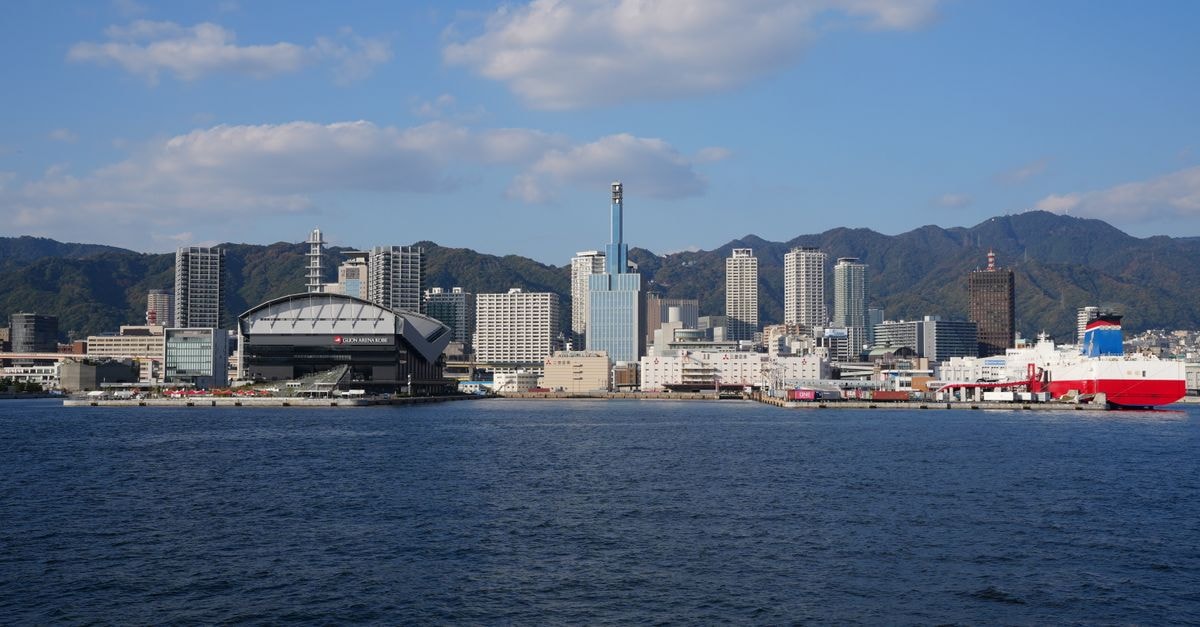 Toyama Travel Guide: Bay Views, Local Bites, and Easy Day Plans Skyline view of Kobe, Japan featuring the port and cityscape against clear blue skies.