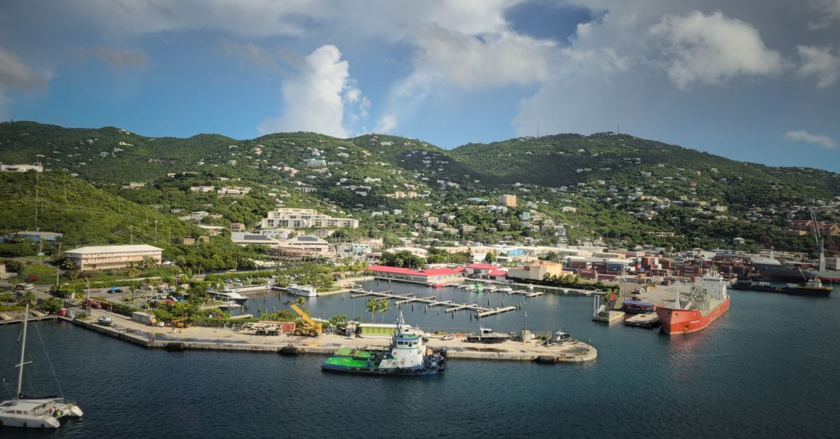 Kingstown Travel Guide: Planning Tips, Costs and Things to Do A scenic aerial view of Charlotte Amalie Harbor on St. Thomas, featuring lush green mountains and clear blue water.