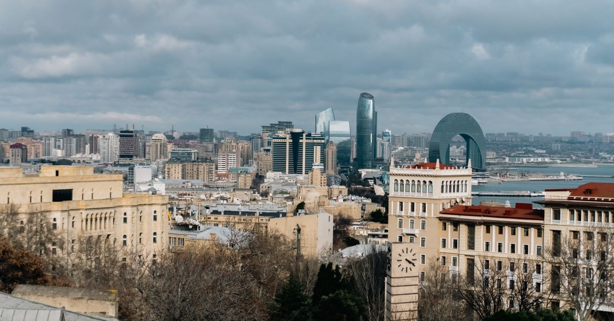Overcast cityscape of Baku, Azerbaijan with iconic architecture and urban skyline.