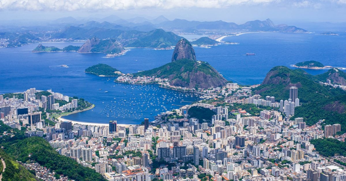 Ibis Budget Rio de Janeiro Centro: A Wallet-Smart Base in the Heart of Rio Stunning aerial view capturing Sugarloaf Mountain and Rio de Janeiro's vibrant cityscape.