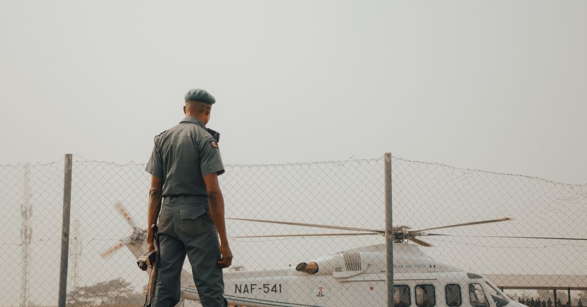 SOLV Energy at IPO-Cycle Peak: Cash Flow Is Thin and the Market Is Paying for a Story A military officer stands watch by an NAF helicopter fenced area in Nigeria.