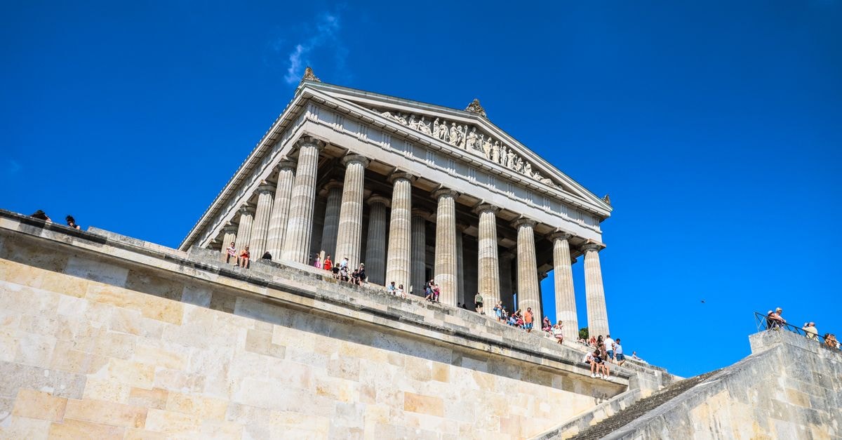 Hotel Walhalla in St. Gallen: A 1904 Station-Side Stay View of the iconic Walhalla Memorial with visitors enjoying a sunny day in Regensburg, Germany.