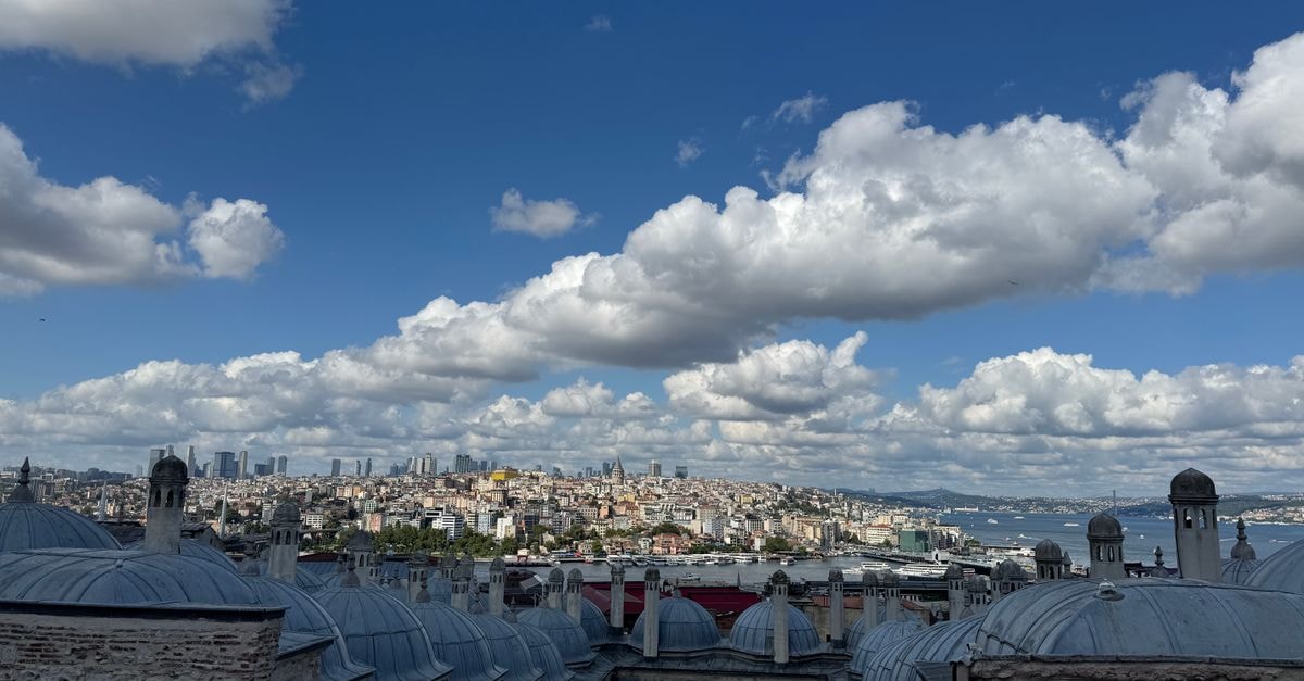 Stunning cityscape of Istanbul with iconic rooftops and Bosphorus under a vibrant sky.