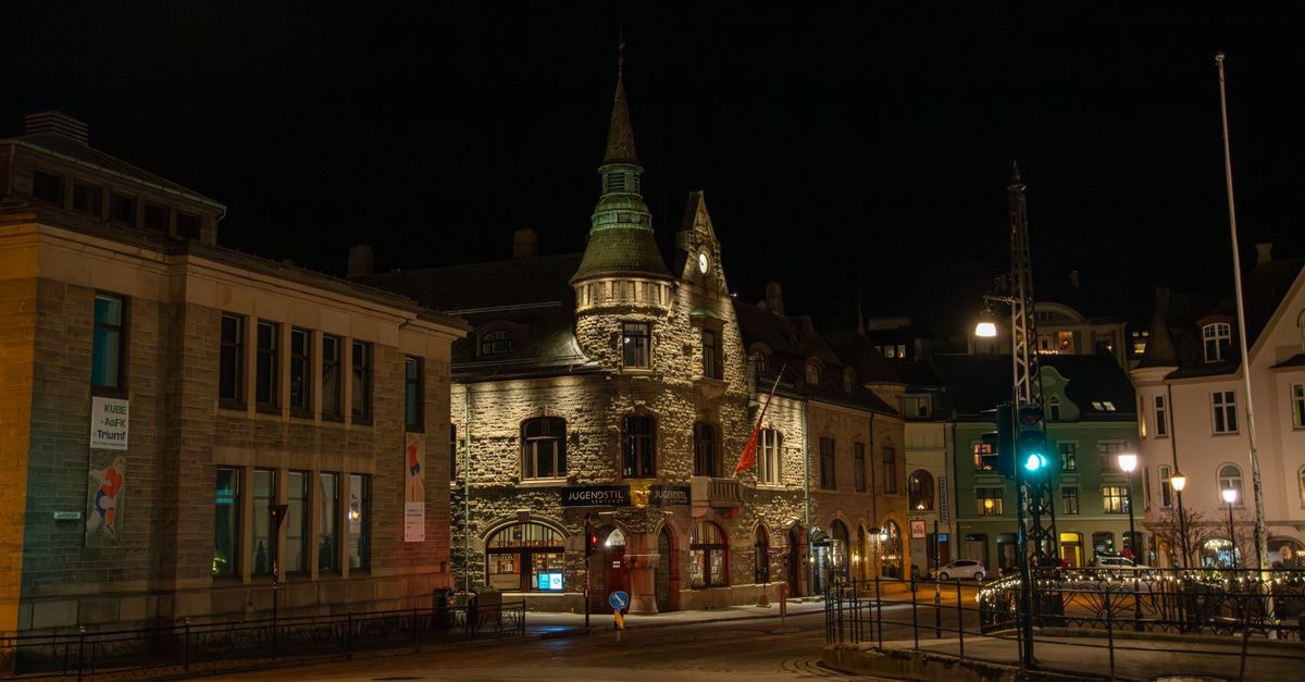 Alesund Travel Guide: Planning Tips, Costs and Things to Do Beautiful night view of Art Nouveau architecture in Ålesund, Norway.