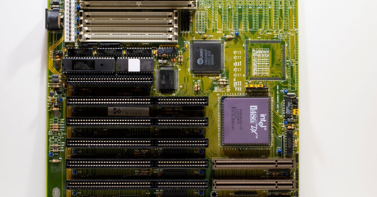 Intel Reportedly to License Atom RTL Code to Startup RosaicLabs for Custom SoCs Close-up of a vintage motherboard showcasing Intel microprocessor and slots for hardware integration.
