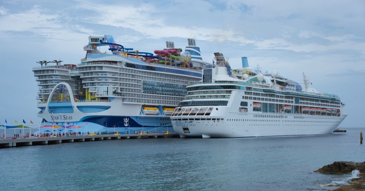Two luxurious cruise ships docked at a lively port in the Bahamas, capturing the essence of tropical travel.