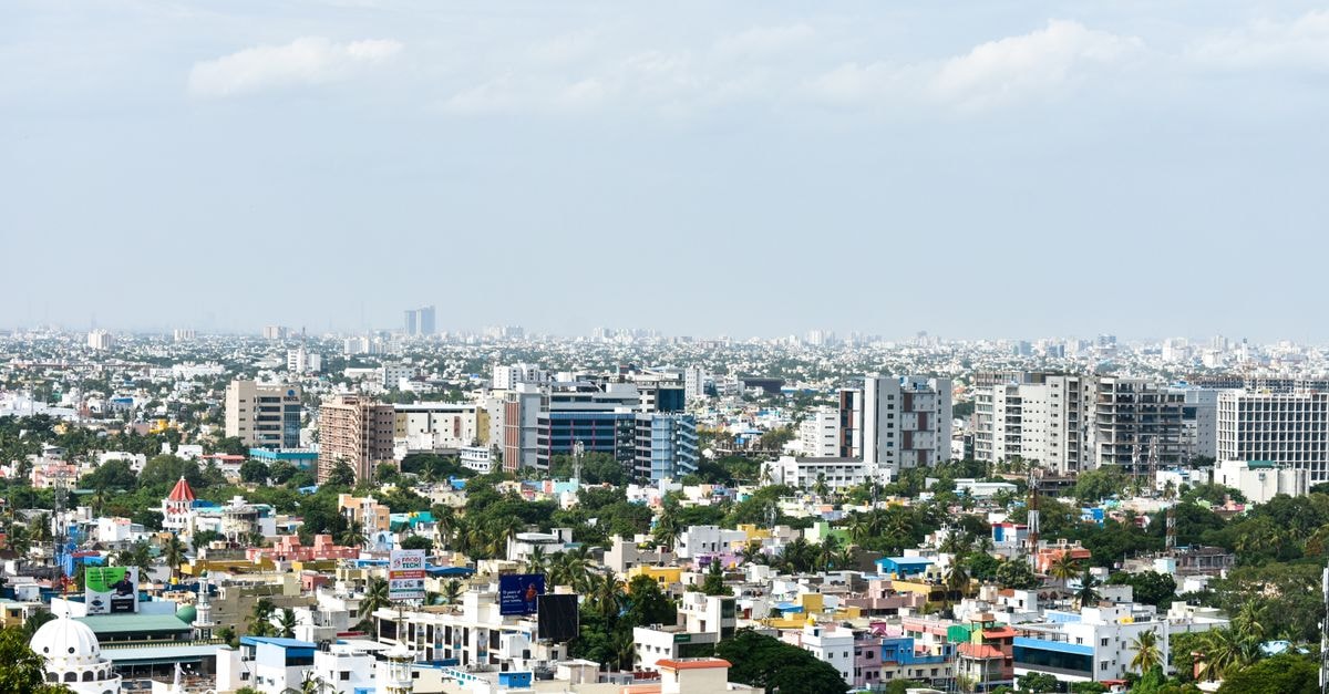 Hotel Blue Star, Chennai — A Practical Stay Near Sowcarpet Market Aerial view of colorful high-rise buildings in Chennai, India, under a clear sky.