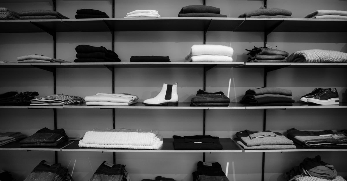 Gap Inc.: One-Time Tariff Refunds Mask a Slow-Declining Core Neatly folded clothing and shoes displayed on shelves in a boutique setting.