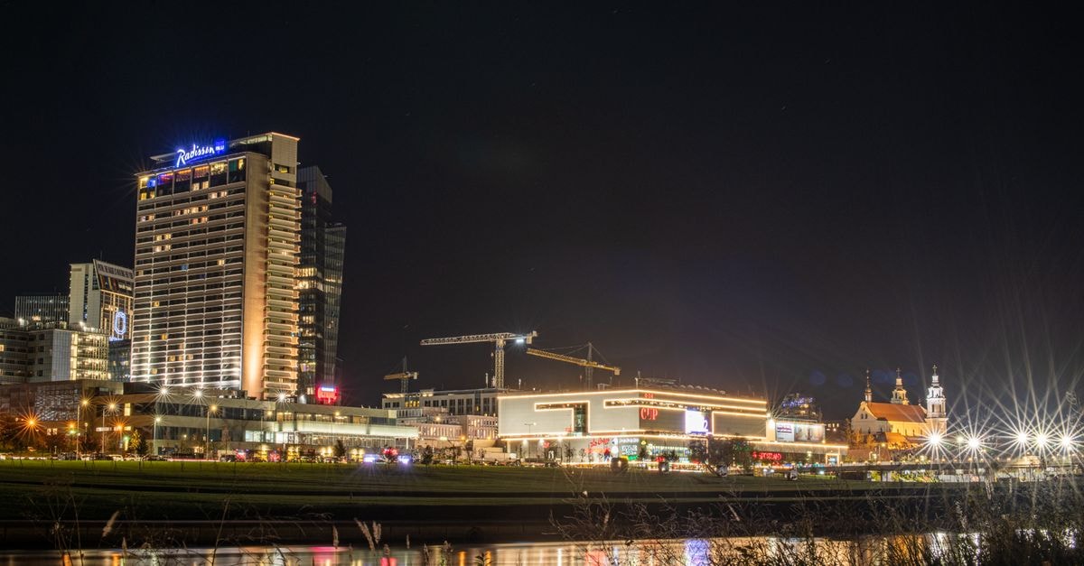 Zemgale in Jelgava — a Modern Hotel Near the Active City Centre Stunning night view of Vilnius, Lithuania, showcasing city lights and modern architecture along the Neris River.