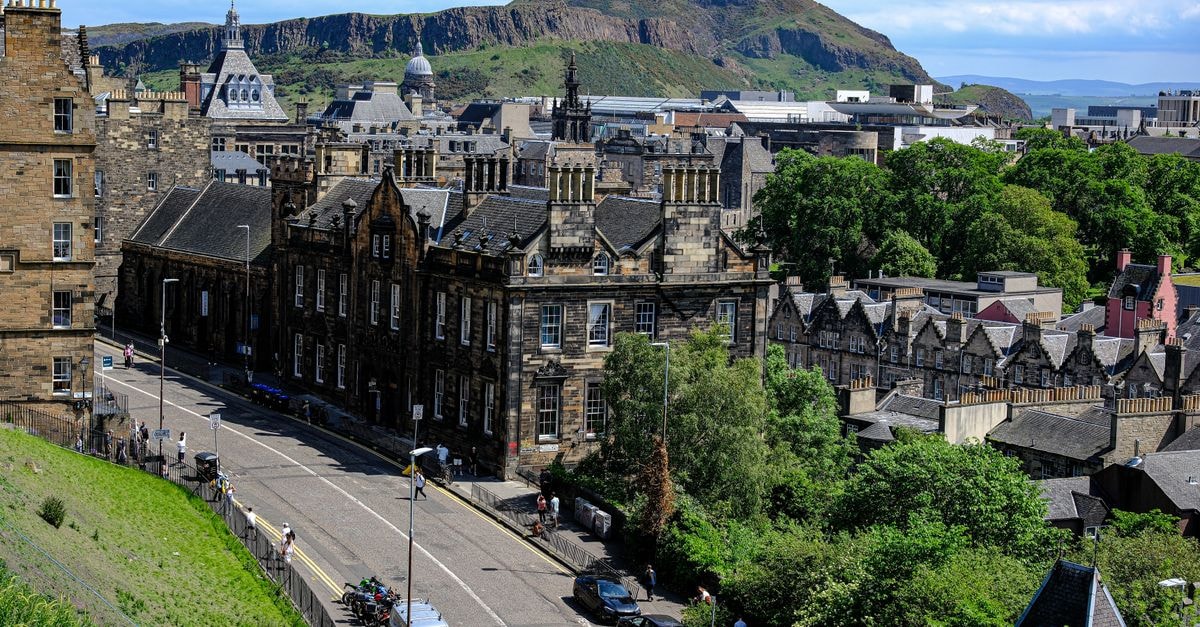 Sanniquellie Hotel in Sanniquellie: A Nimba County Stop on the Liberia–Côte d'Ivoire Road Panoramic view of historic Edinburgh architecture with Arthur's Seat in the background.
