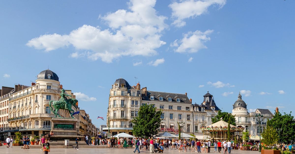 Campanile Hôtel in Orléans: Steps from the Pedestrian Republic Street Vibrant scene in Orléans, France with historic buildings and lively crowd.