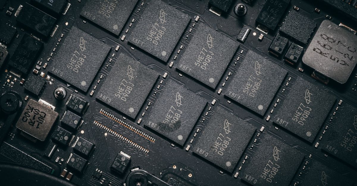 TSMC Pulls Forward 3nm Output Target as AI Customer Demand Builds Detailed view of electronic circuit board components showcasing microchips and technology intricacies.