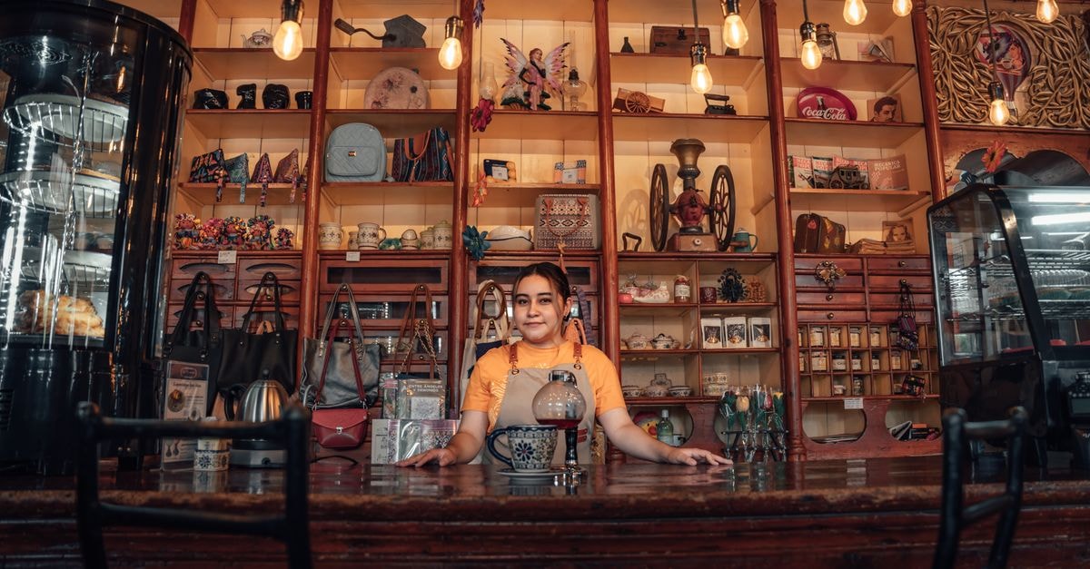 Franca Travel Guide: Coffee Roots and Outlet Finds Explore a Mexican shop interior with vibrant decor and hanging lights in Lerma de Villada, Mexico.