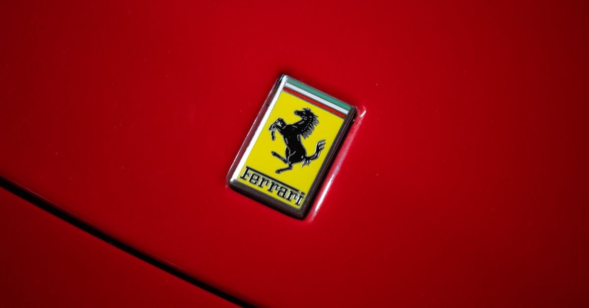 Hotel Mauritour فندق موريتور in Rosso: A Compact Address Worth Knowing Bright red Ferrari with the iconic prancing horse emblem close-up.