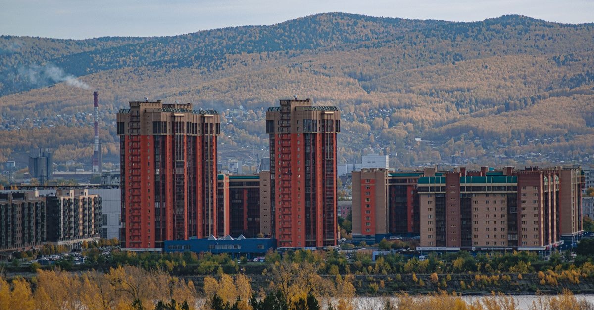 Magnitogorsk Travel Guide: Planning a Trip to Russia's Steel City A stunning view of Krasnoyarsk cityscape featuring modern skyscrapers along the Yenisei River.