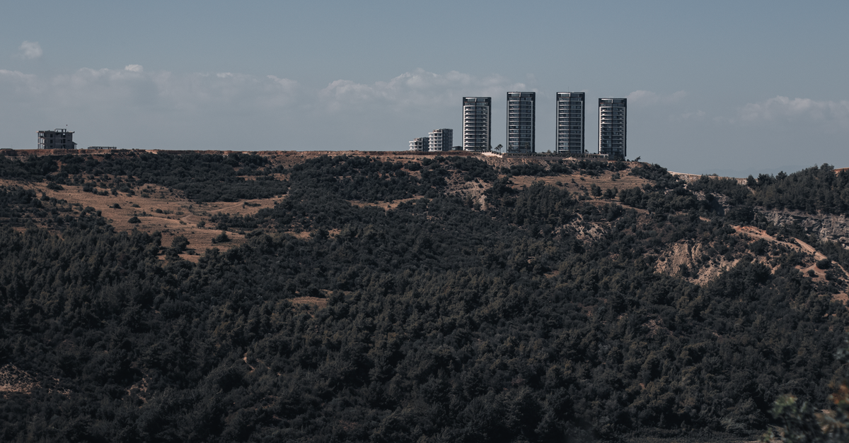 Stunning landscape of Adana, Turkey featuring high-rise towers and natural surroundings.