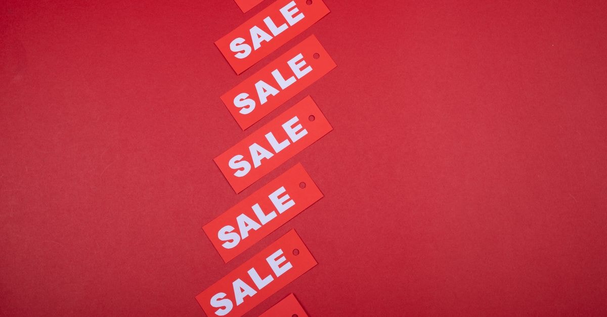 Samsung cuts Galaxy S26 Ultra price in India by Rs 15,000 across retail channels Red sale tags aligned diagonally on a red background, perfect for retail promotions.