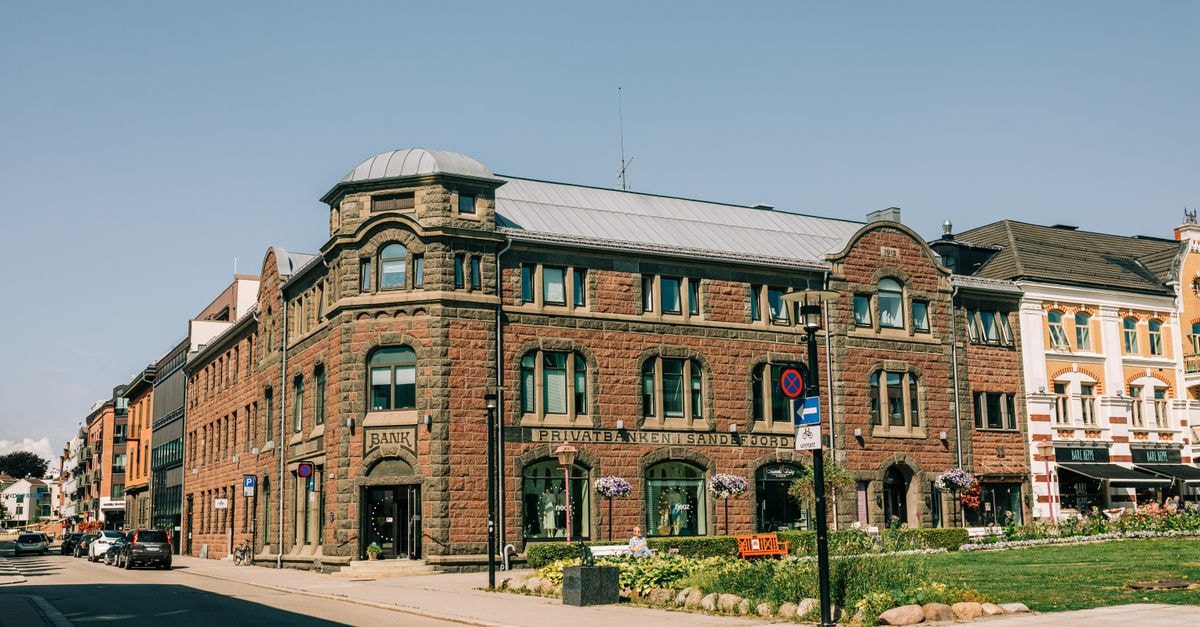 Historic architecture of a private bank building on a sunny city street.