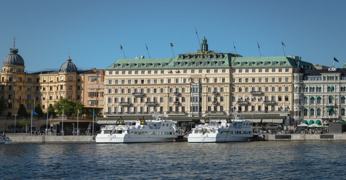 View of the historic Grand Hotel in Stockholm by the waterfront.