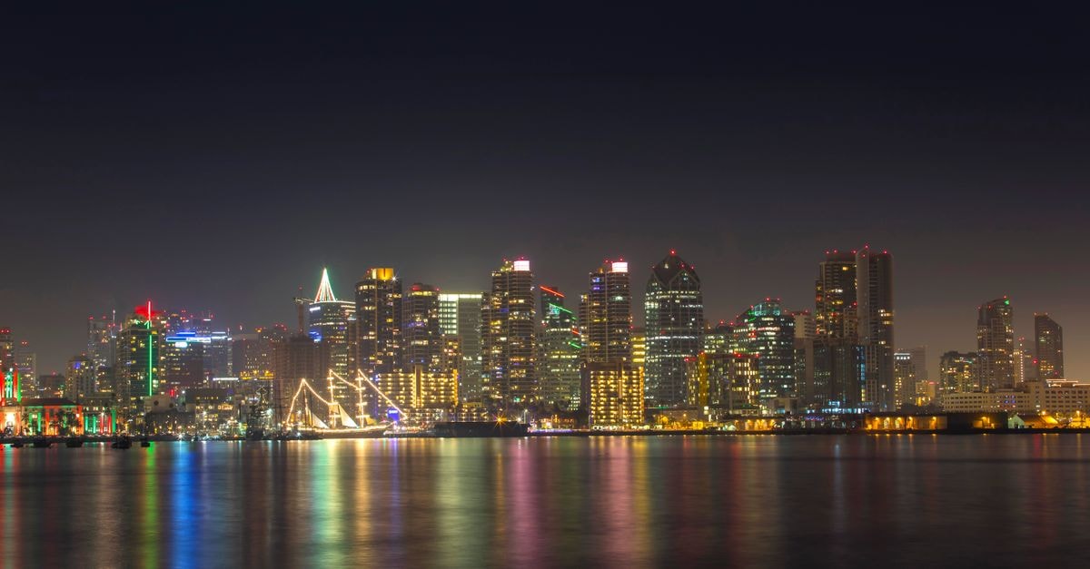 Hotel Republic San Diego, Autograph Collection: City Views in Downtown San Diego A serene night view of San Diego's illuminated skyline reflecting on calm water.