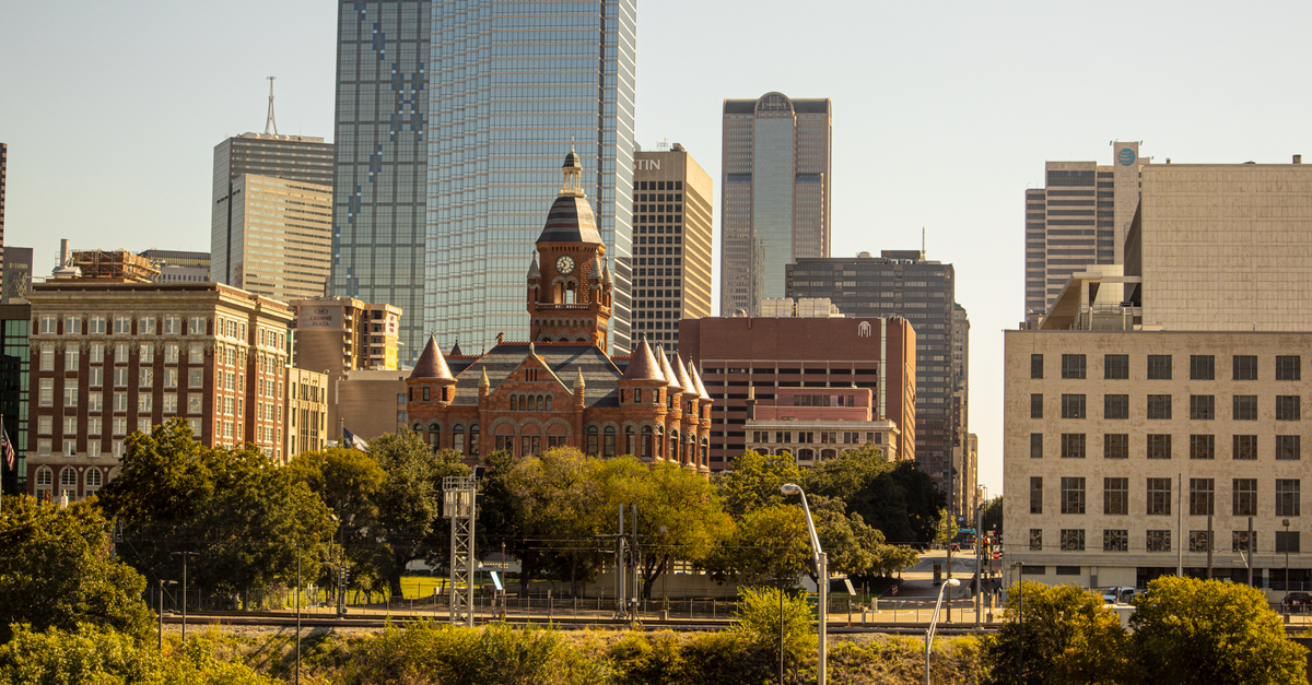 Plano, Texas: a thoughtful travel guide to the DFW suburb Scenic view of Dallas skyline featuring the Old Red Museum and skyscrapers.