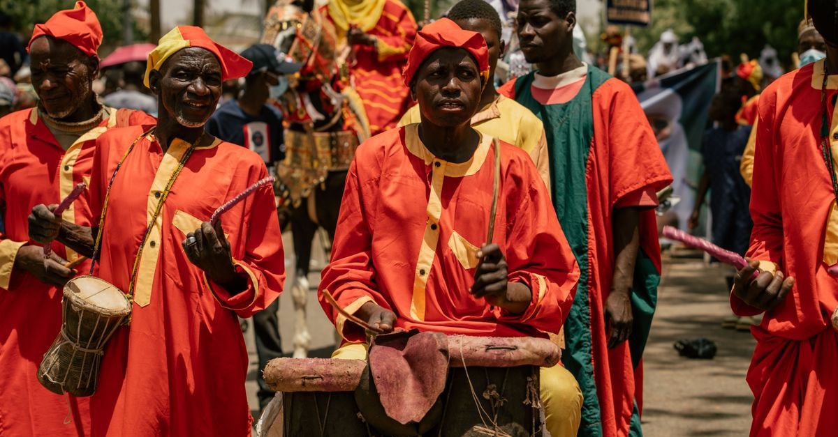 Kaolack travel guide: salt, peanuts, and Senegalese rhythm Vibrant street parade featuring African drummers in traditional attire. Perfect for cultural events.