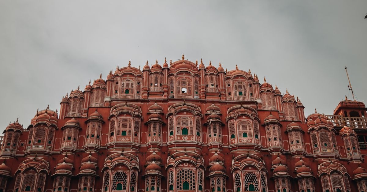 Capture of the iconic Hawa Mahal's intricate pink sandstone facade in Jaipur, India.