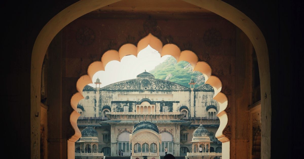 Baotou Travel Guide: Steel City, Grassland Gateway, and More Explore the historical beauty of Alwar City Palace through an archway view.